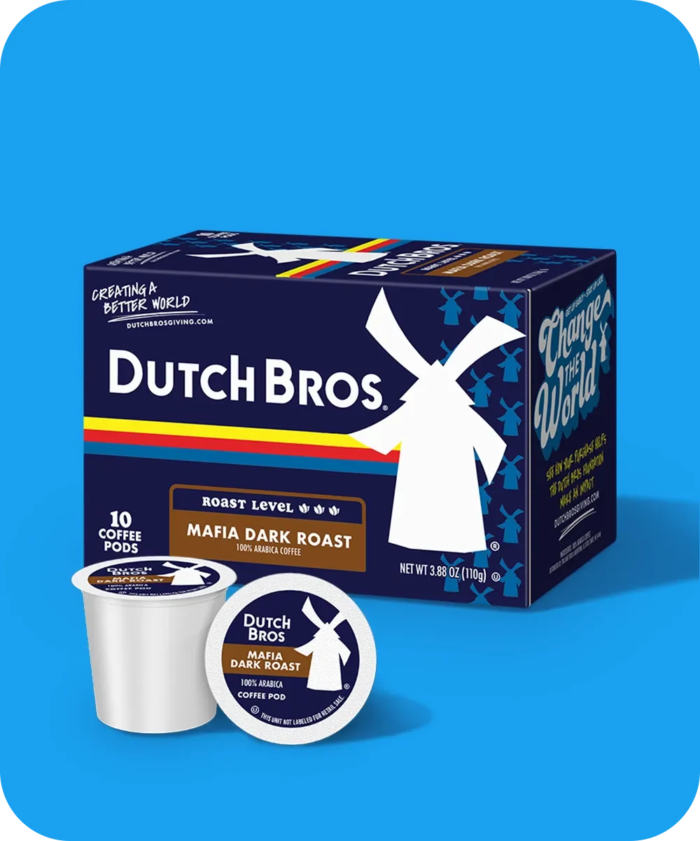 Dutch Bros coffee box of Mafia Dark Roast pods with a single pod displayed in front, on bright blue background.