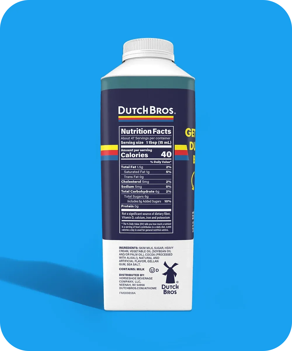 Dutch Bros coffee creamer bottle with nutrition facts displayed on navy blue label against bright blue background.